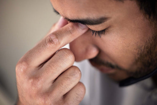A man suffering from sinus infection from allergies