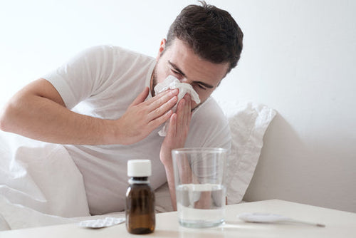 A person going through stages of common cold