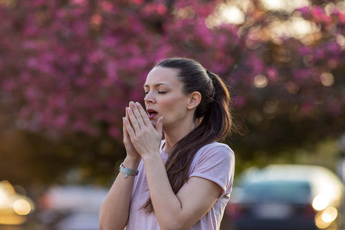 A woman dealing with seasonal allergies