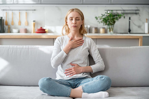A woman experiencing shortness of breath due to allergies