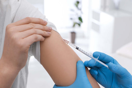 An allergy shot being injected to a person