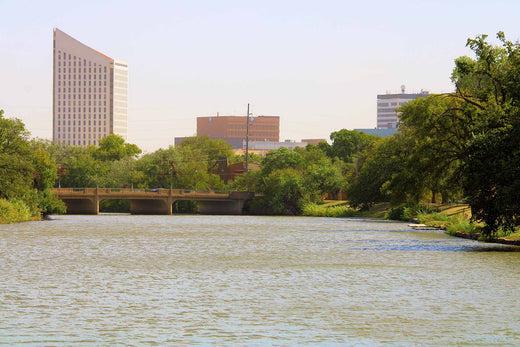 Wichita skyline along a tree-lined river, a U.S. city known for high seasonal allergies.